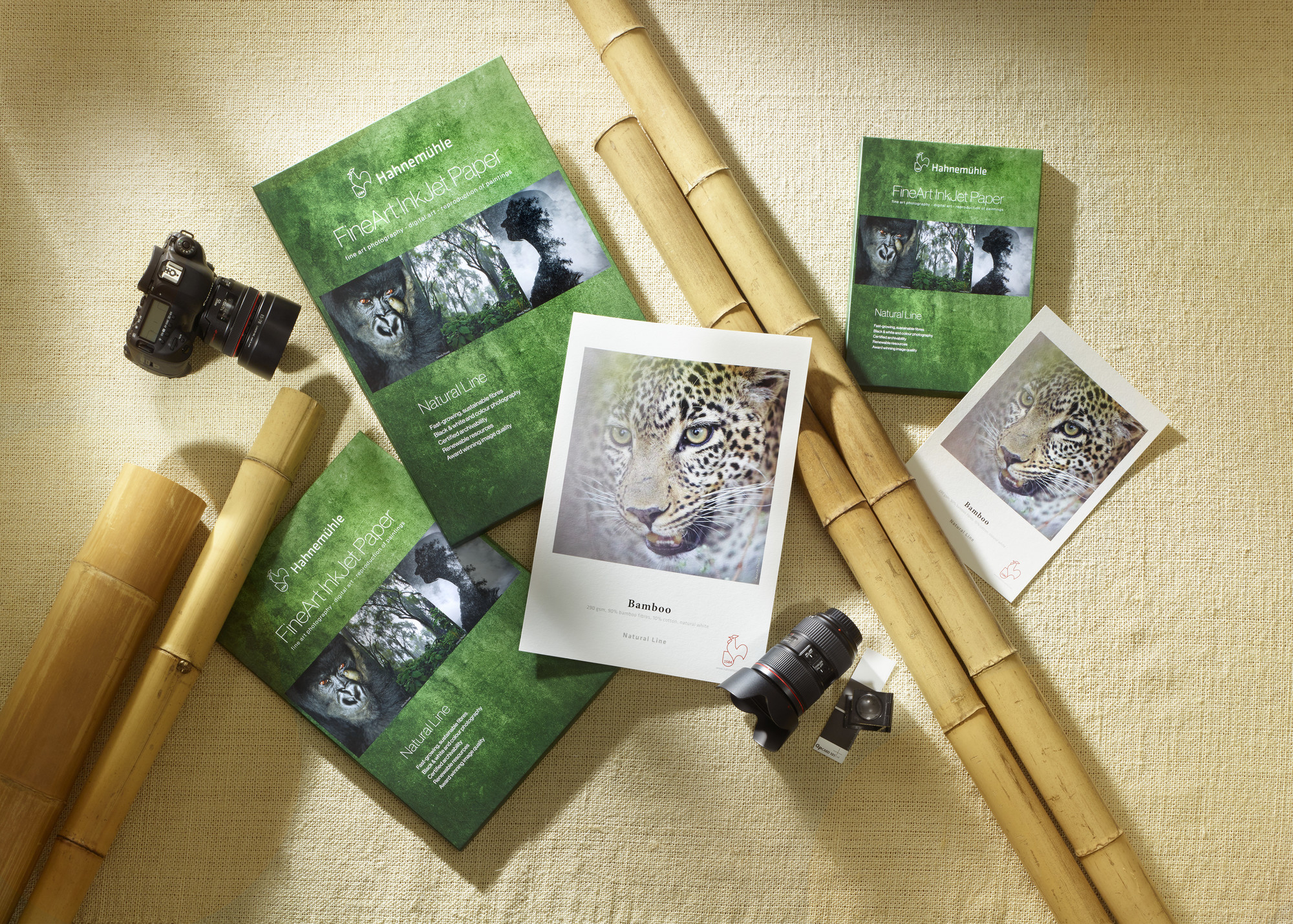 Several packs of Bamboo paper are pictured. Next to them are photo prints.