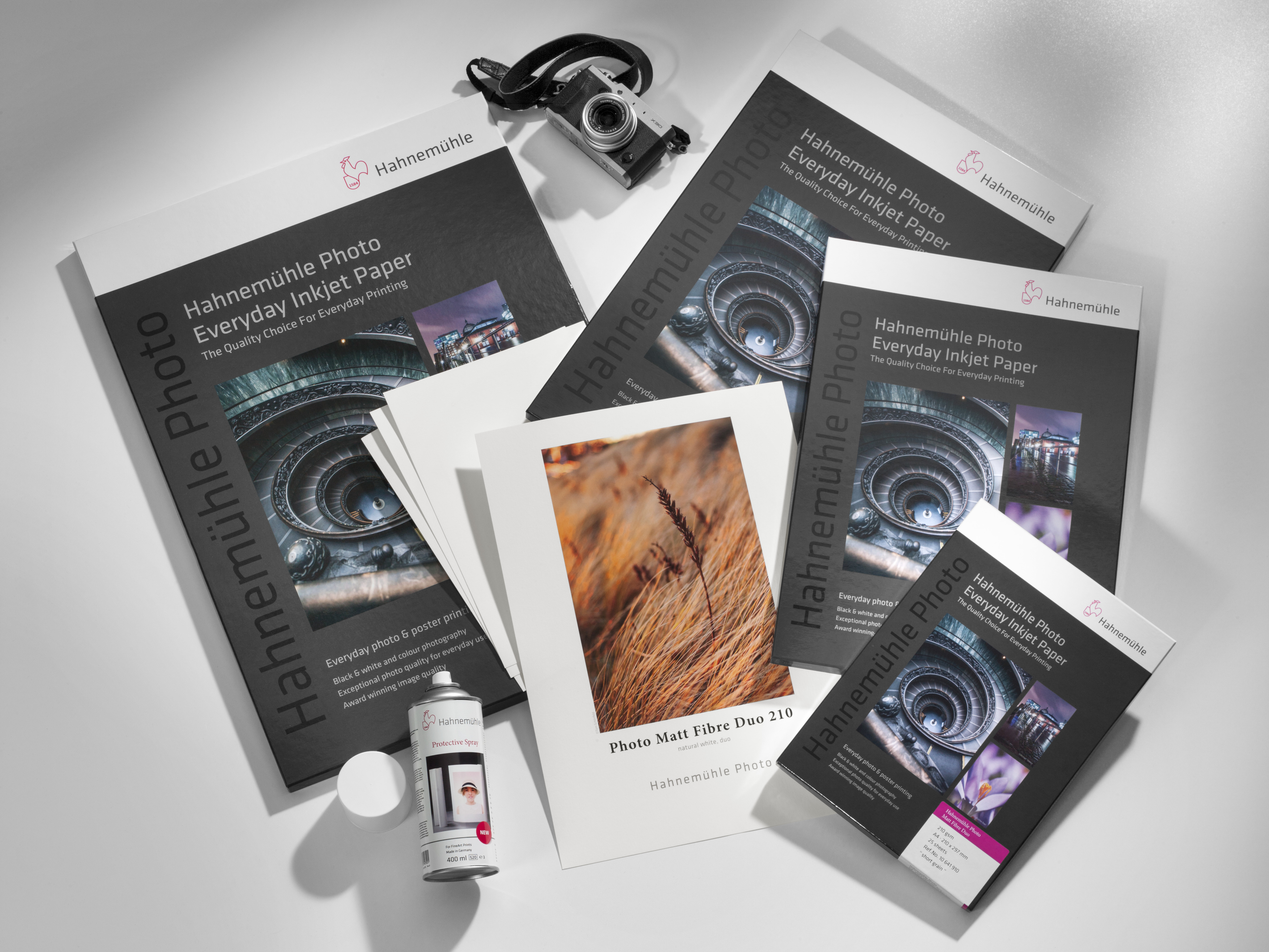 mood-photo-matt-fibre-duo-210 Different packaging of the Photo Matt Fibre Duo paper are on the table