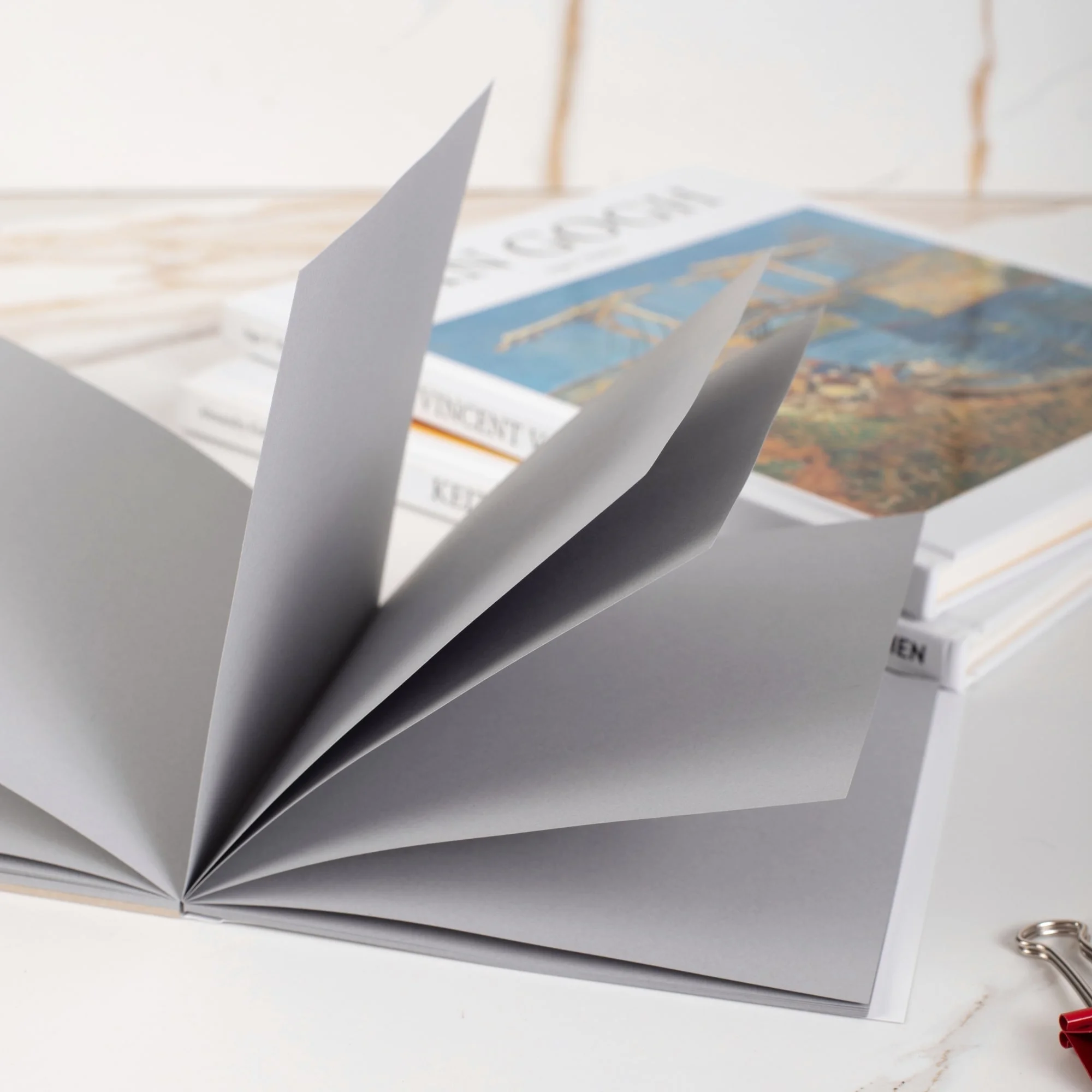 blank notebook, gray pages, open book, paper stack, photography prop