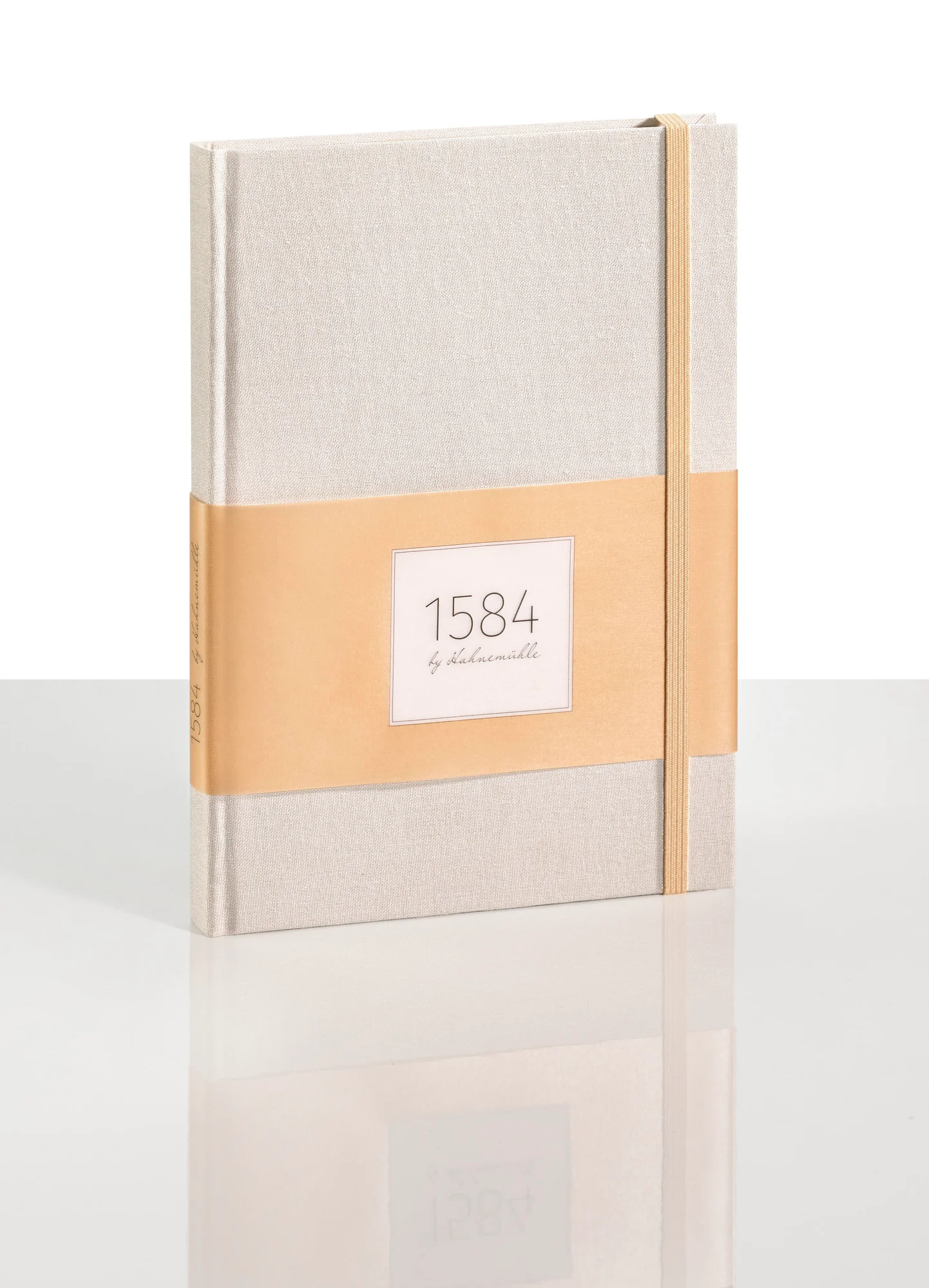 notebook, linen, beige, elastic band, ephemeral label?